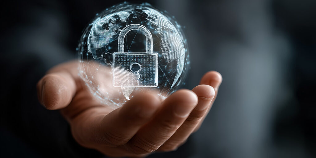 Hand hält eine Weltkugel mit einem Schloss darin